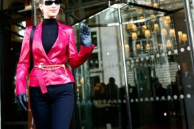 Bella Hadid having some fun with the hot pink and chain belt trends on Day 6 of Paris Fashion Week.