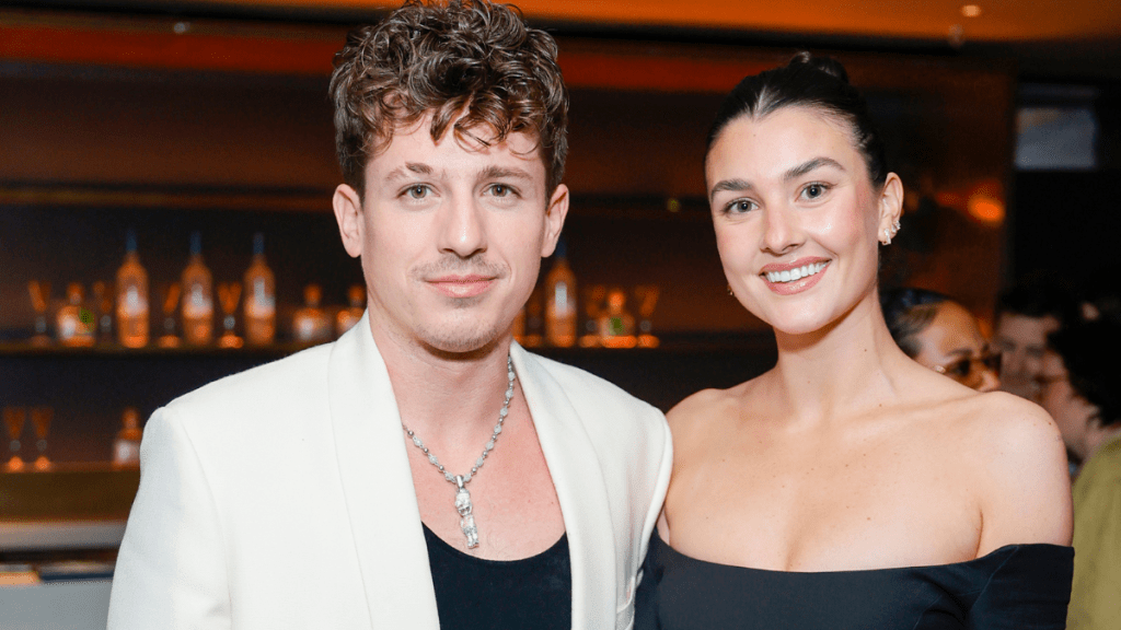 Charlie Puth and Brooke Sansone attend Interscope x Flipper's Roller Boogie Palace celebrating Dr. Dre's "The Chronic" with a star-studded party hosted by Usher and held in partnership with Meta and ORBIT Gum. Guests enjoyed plant-based bites from Tattooed Chef and toasts of PATRÓN EL ALTO at Hollywood Palladium on February 04, 2023 in Los Angeles, California.