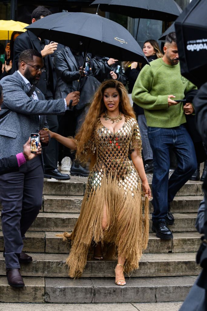 Cardi B wears a Rabanne dress and necklace with Tom Ford shoes outside the Rabanne show 